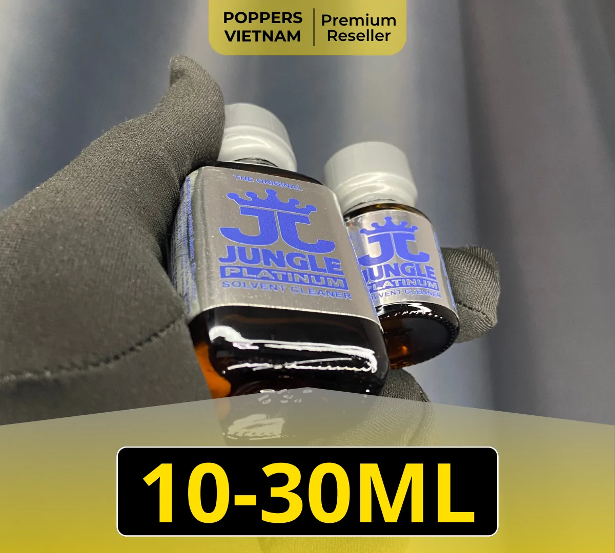 Jungle Juice Platinum Poppers (10ml & 30ml) – Top-rated smooth formula at Poppers Vietnam. Premium silver/platinum bottles held by black gloves featuring the blue Jungle logo.